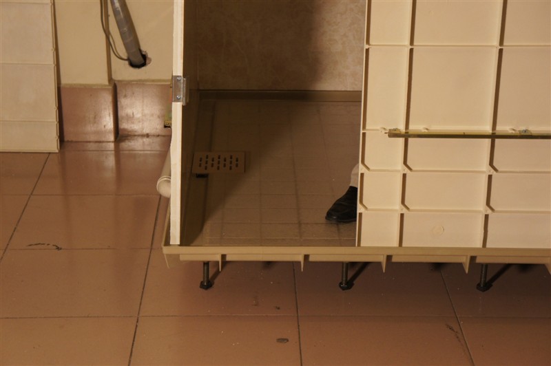 Raised bathroom pod base with adjustable supports