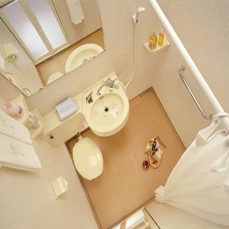 One-piece molded SMC bathroom floor inside a bathroom pod